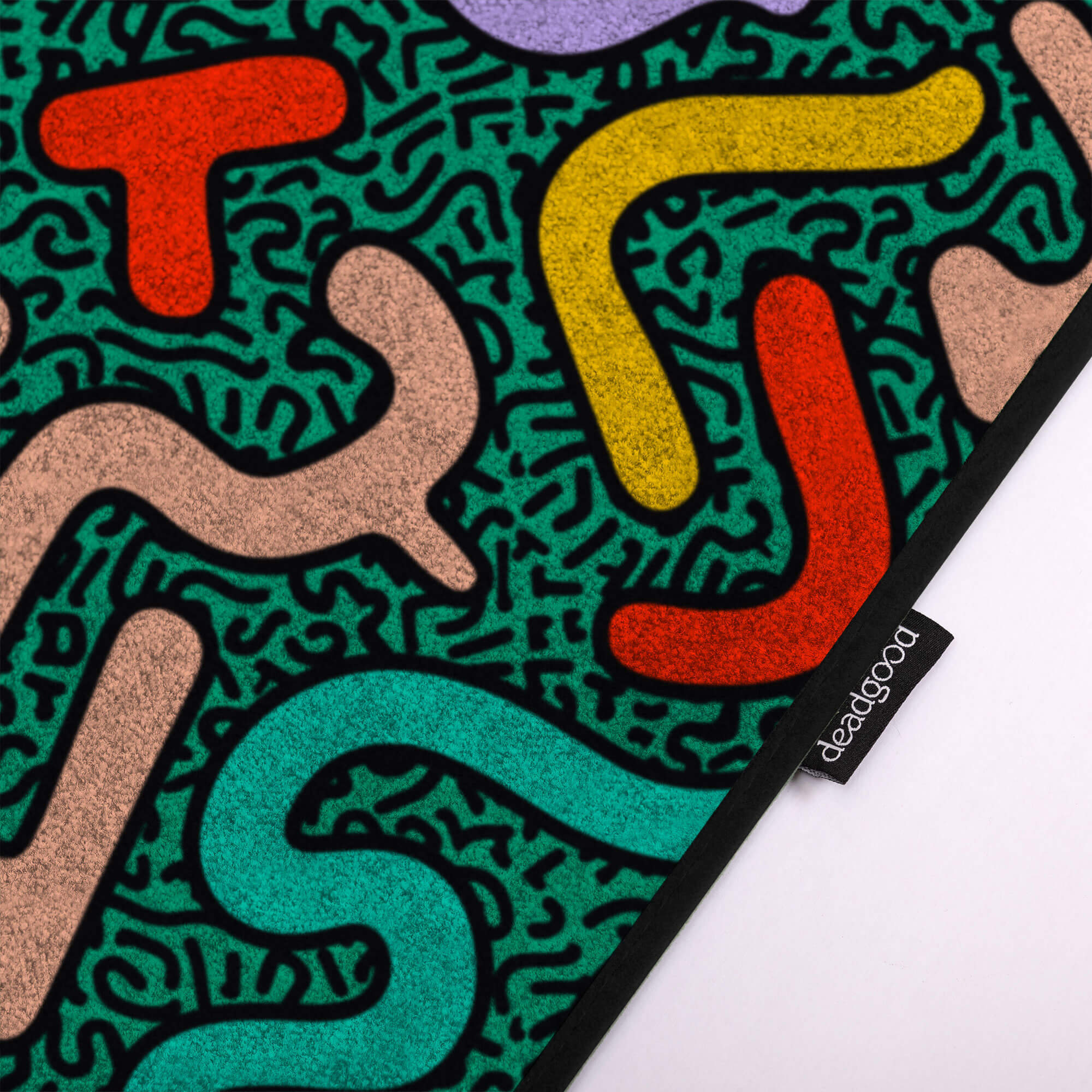 Detail of an abstract and colourful rug for creative design studios