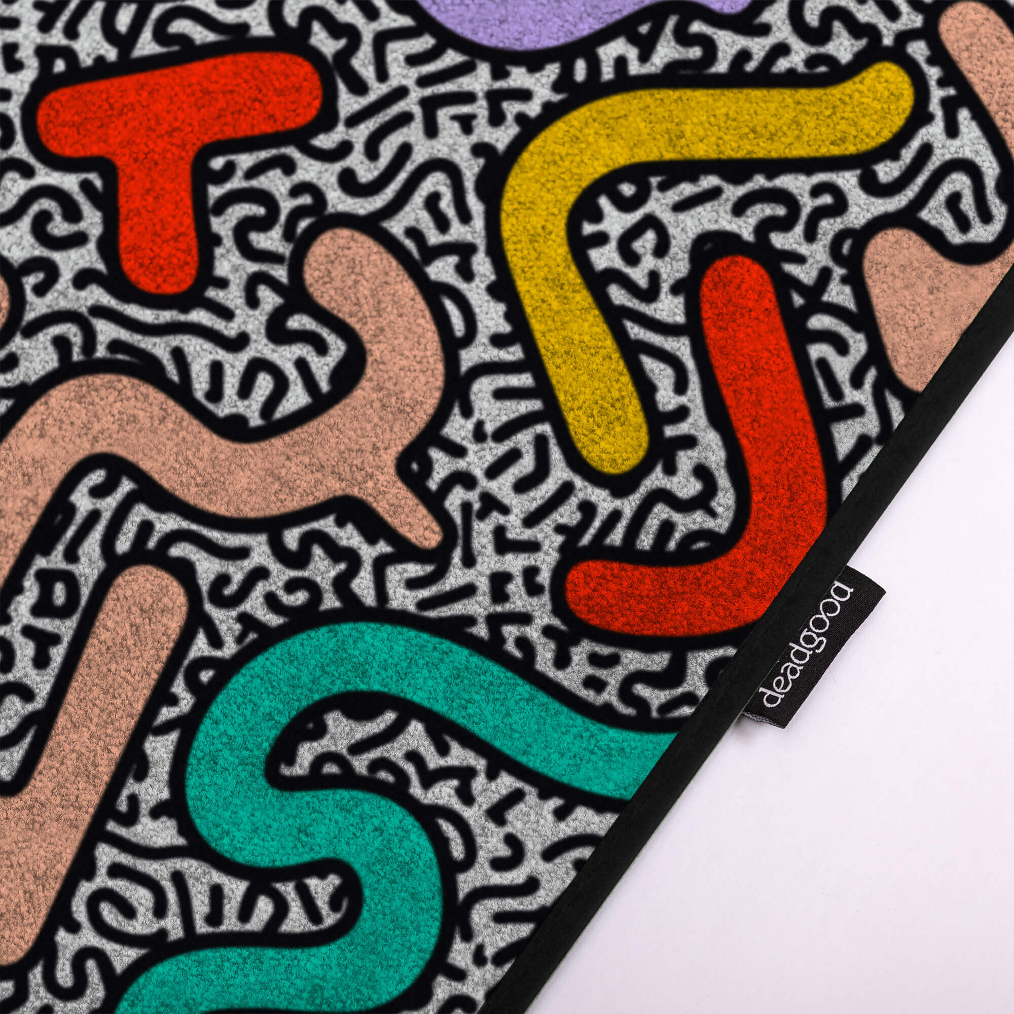 Detail of an abstract and colourful rug for creative design studios