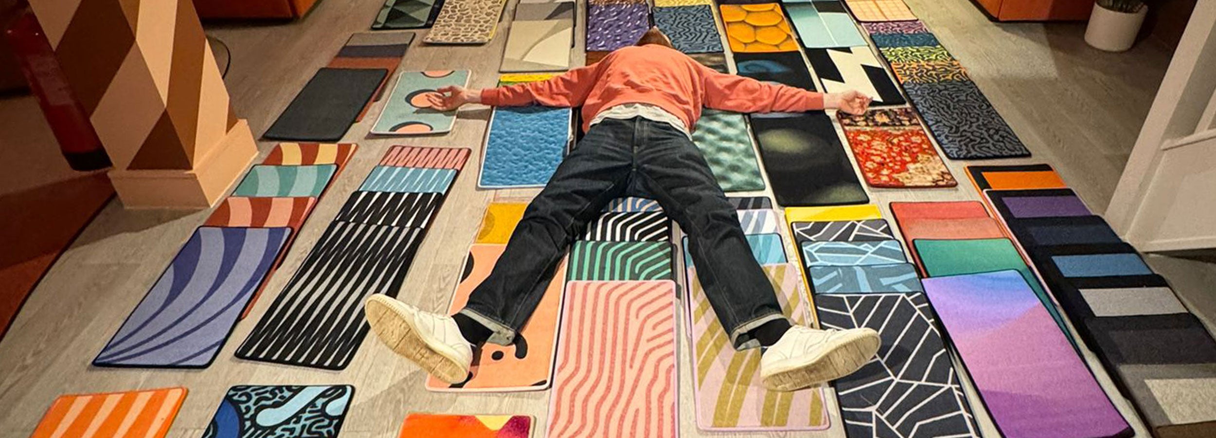 Custom rug design consultation showcasing colour options for commercial clients