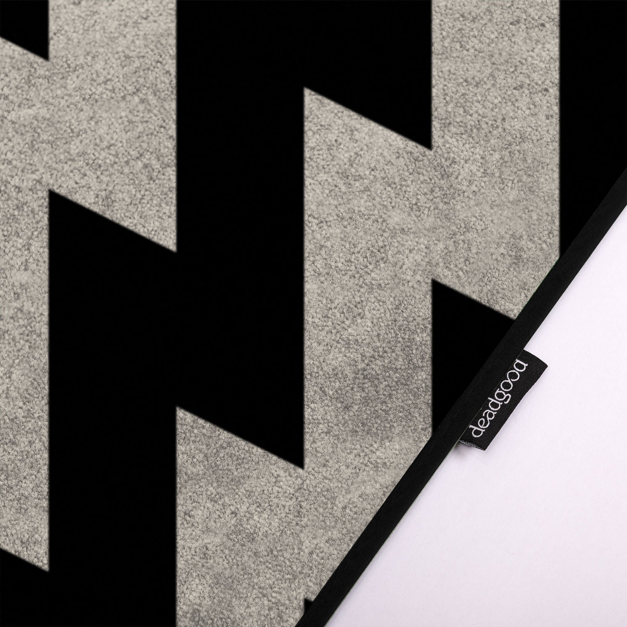 Detail of a Black and White Geometric patterned rug for innovative coworking spaces